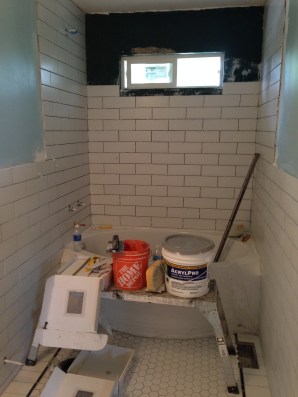 Our new, smaller bathtub window and subway tile surround.